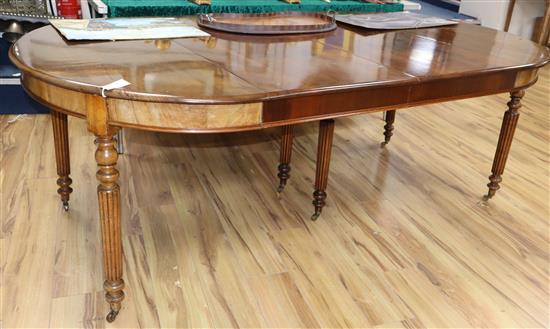 A Regency style mahogany extending D-end dining table with two additional leaves 208cm extended
